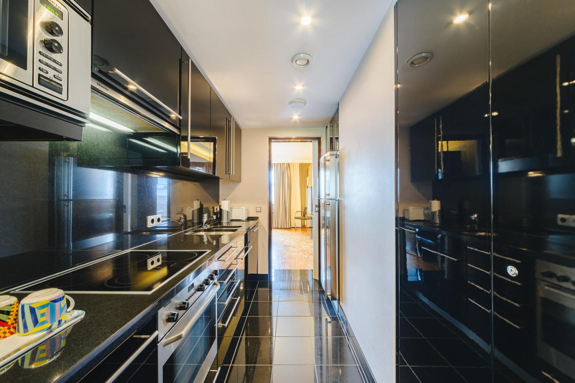 โรงแรมพูลแมน เบอลิน ชไวเซอร์ฮอฟ เบอร์ลิน ภายนอก รูปภาพ A kitchen in a private house